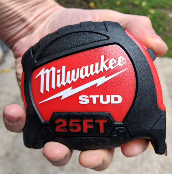 Milwaukee Stud 25ft Tape Measure in a medium sized hand